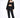 Model in Carbon 3-piece tracksuit set with a 'Relax' tube top, zip-up hoodie, and joggers for urban streetwear.