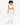 A model showcases a stylish white cropped top paired with matching jogger pants and white sneakers.