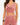 Cropped top with a draped neckline and gold accent, paired with matching pants.