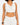 Cropped top with a draped neckline, paired with pants, showcasing a stylish and casual look.