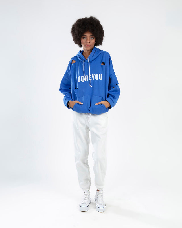 ADOREYOU Blue Oversized Streetwear Hoodie with Distressed Cut-Outs on a model wearing white joggers.