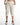 Freya high-waisted white wide-leg pants with drawstring waist and elastic cuffs, styled with pink sneakers.