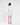 Back view of the Nina cream skirt set featuring a cropped blazer and matching mini skirt on a model.
