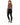 A woman with long hair poses in a fitted brown top and black skinny jeans, showcasing a stylish back cutout.