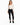 A model wearing a fitted long-sleeve bodysuit with a deep V-neck and cut-out sides, paired with black skinny jeans an...
