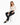 A model poses in a fitted long-sleeve top with a deep V-neck and cut-out detail, paired with black skinny jeans and s...