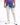 Light-wash jeans with a distressed design and blue tie-dye effect, paired with a purple shirt and white sneakers.