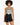 A model with curly hair wears a patterned bodysuit paired with high-waisted black denim shorts.