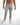Odin light grey jeans for men featuring distressed knee details and a tapered leg streetwear style.