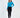 Model wearing the Goldie long sleeve blue ribbed crop top with a shoulder cutout and high-waisted dark jeans.