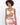 A model poses in a tropical print crop top and matching skirt, featuring vibrant floral patterns and a stylish cut.