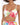 A model showcases a tropical print crop top with vibrant leaves and a knotted front detail.