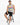 A man sits on a stool wearing a sleeveless gray top with colorful graphic text, black ripped shorts, and stylish snea...