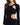 A fitted black dress featuring long sleeves and stylish cut-out details at the waist.