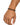 A close-up of a hand wearing a beaded bracelet featuring black matte beads and copper accents.