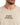 A close-up of a light beige t-shirt featuring stylized text in dark brown, showcasing a unique graphic design.
