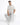 A man sits on a white cube wearing a light-colored T-shirt with a textured "PEACE" design, paired with gray pants and...