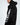 A model wearing a black hoodie with a zippered sleeve and bold white lettering along the side.