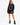 A model wearing a black oversized sweatshirt with a circular text design, paired with black ankle boots.