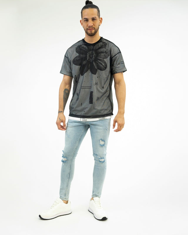 Model wearing Bobby Light Blue Super Jeans with distressed knees and a light wash streetwear finish.