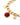 Gold chain bracelet featuring a faceted red gemstone and a starfish charm.