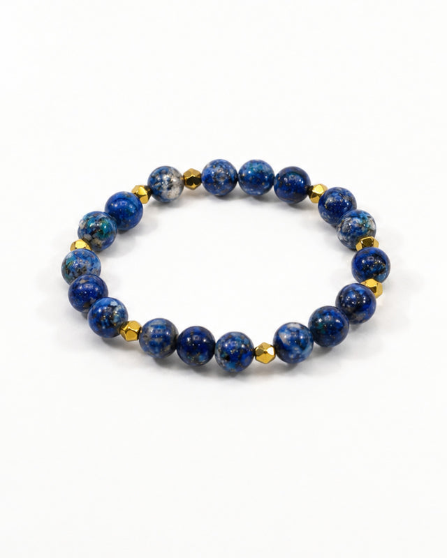 A circular bracelet featuring deep blue beads interspersed with gold accents.