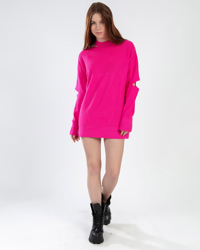 Model wearing the Brooke hot pink oversized knit sweater with shoulder cut-outs and a mock neck.