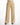 Beige wide-leg pants with pleats and a button closure, styled with a light top and black heeled sandals.