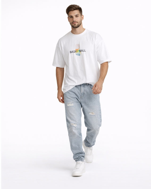 Front view of blue washed jogger jeans with elastic cuffs and distressed detailing.