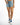 High-waisted Journi blue washed denim shorts with raw hem and distressed details, paired with white and blue sneakers.