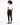 A model with curly hair wearing a white t-shirt and black skinny jeans, viewed from the back.