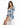 A model poses in a fitted dress with a floral blue and white pattern, featuring puffed sleeves and a square neckline.