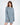 Model wearing the Saylor blue oversized cable knit sweater featuring distressed holes and a loose pullover fit.