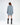 Rear view of the Saylor blue oversized cable knit sweater featuring distressed detailing and a relaxed tunic fit.