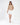 Serena beige cable knit turtleneck sweater paired with a white mini skirt.
