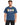 A man wearing a blue graphic t-shirt featuring colorful designs and the phrase about kindness.