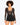 A model poses in a sheer black long-sleeve top with a deep neckline and high-waisted black shorts.