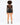 A model with curly hair wears a sheer long-sleeve top and high-waisted black shorts, showcasing a stylish back view.