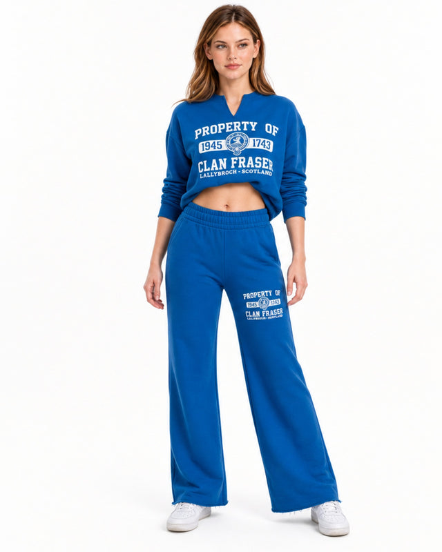 Blue wide-leg pants with an elastic waistband, paired with a matching cropped sweatshirt.
