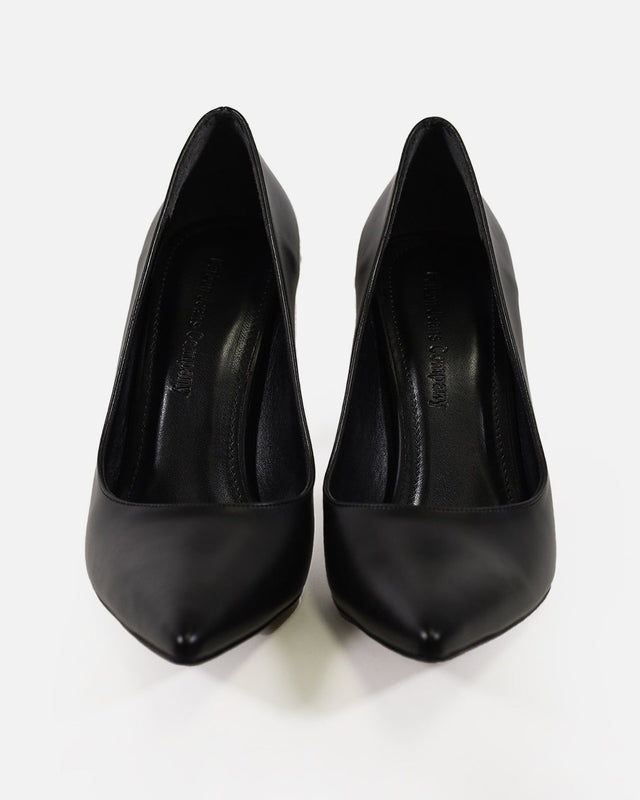 Pair of sleek black carbon pointed-toe stiletto pumps, high-angle front view on white background.