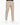 Beige tailored pants, featuring a chain detail and paired with white sneakers.