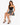 A model poses in a fitted black top and a flared skirt with a bold animal print, paired with strappy black heels.