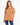 A woman models, short-sleeve, brown tee with a simple white graphic on the chest.