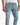 Light blue distressed jeans featuring rips and a chain detail, styled with a casual white shirt.