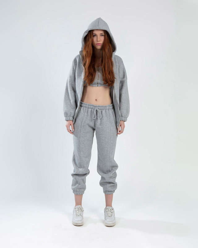 LILY PANTS SET: Light grey three-piece loungewear featuring a zip-up hoodie, crop top, and drawstring joggers.