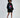 Model in an oversized black hoodie with a pink lips graphic print, ruched sleeves, and front pocket.
