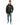 Man wearing the Decent black streetwear hoodie with orange graffiti logo and blue distressed jeans.