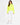 A model wearing a bright neon yellow turtleneck top paired with white jogger pants and white sneakers.