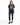 A woman stands confidently in a graphic t-shirt featuring a Florida design, paired with dark skinny jeans and black s...
