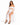 A model poses in a white off-the-shoulder top with puff sleeves and a matching high-slit skirt, paired with black heels.